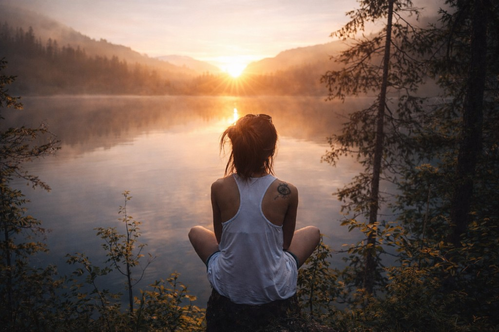 A tarot spread showing the High Priestess flanked by the Eight of Pentacles and Five of Cups, illustrating how context generates meaning beyond individual card definitions