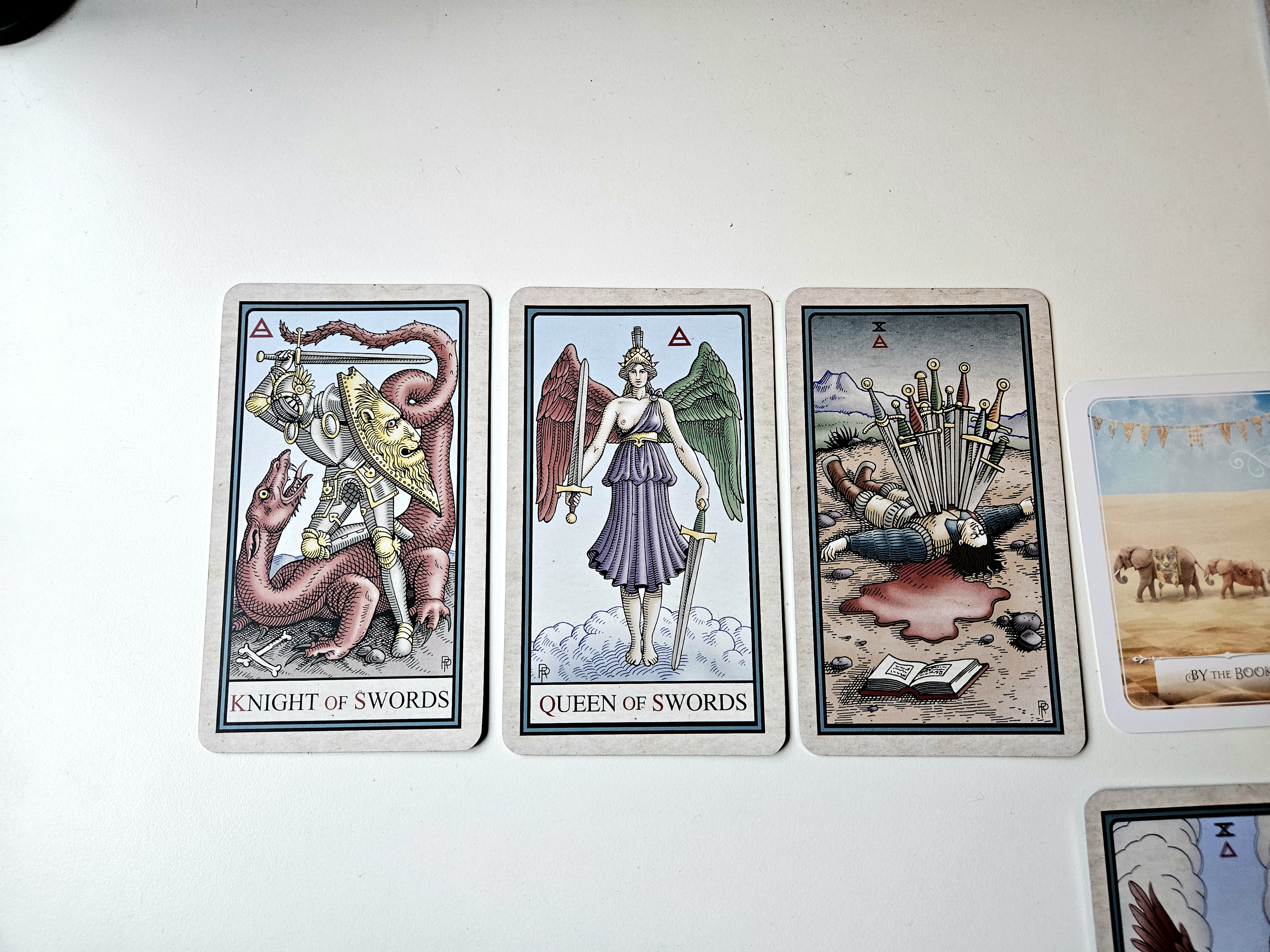 Spread left: Knight, Queen, Ten of Swords